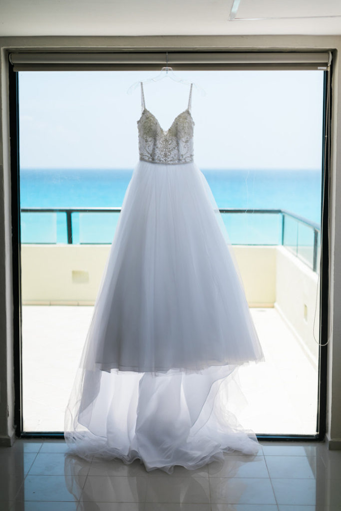 Wedding dress hanging on the window at Crown Paradise Club 