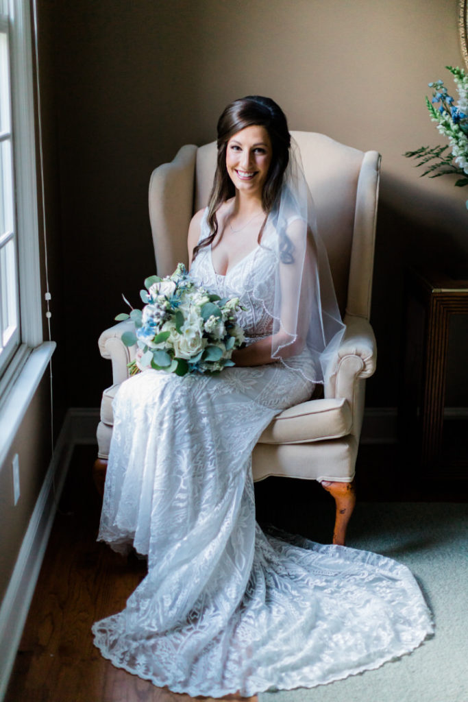 Bride sits in her wedding dress and awaits her wedding ceremony