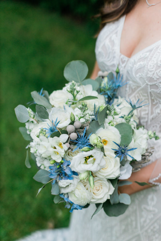 White and blue bridal bouquet by The Blue Daisy