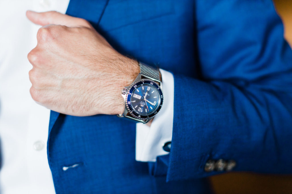 Macro photo of grooms blue watch