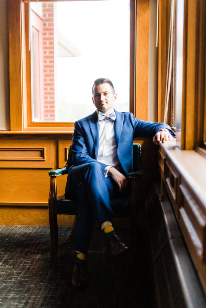groom sits patiently as he awaits his wedding ceremony at Edgewood Club in Pittsburgh, PA