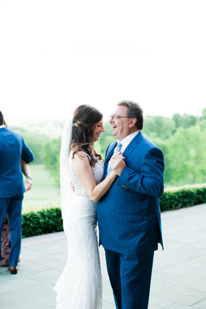 Bride and father of the bride share first dance on the veranda at their summer Edgewood Club wedding