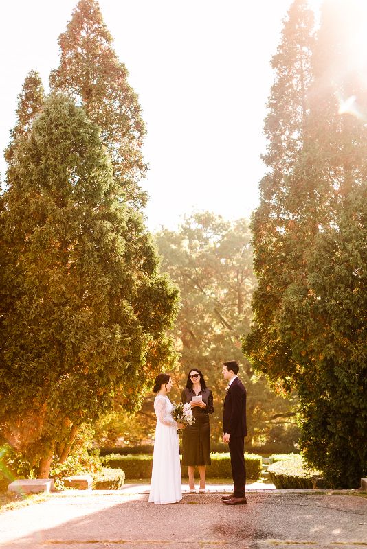 Bride and groom say their vows during fall Mellon Park elopement