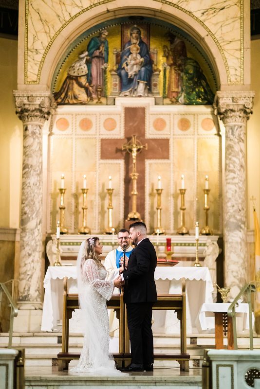 Bride and groom say their vows in Catholic Church