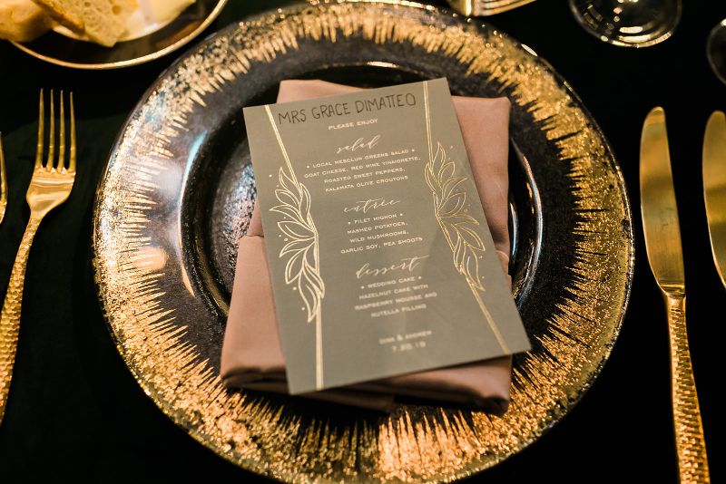 Macro photo of black and golf table
setting for Glam Pittsburgh Opera Wedding Reception