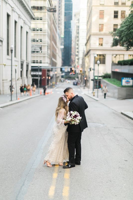 Bride and Groom kiss in the middle of Pittsburgh street
