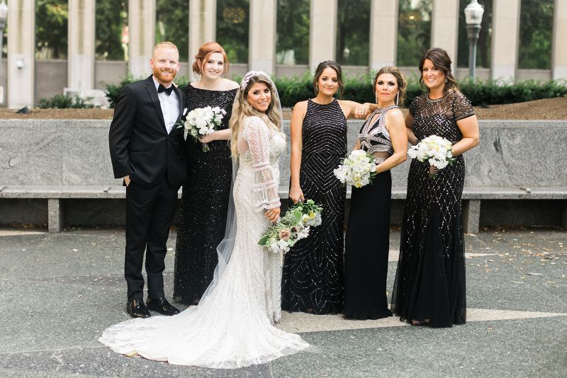 Bride poses with bridesmaids and bridesman in Mellon Square