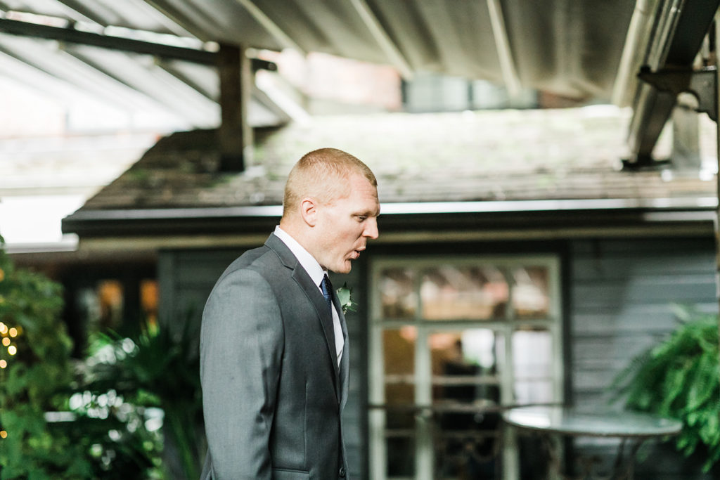 Groom takes deep breath before the first look