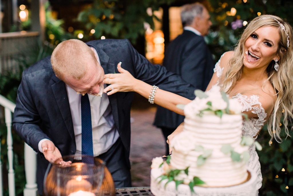 Bride and groom cut and smash their cake at Morning Glory Inn wedding