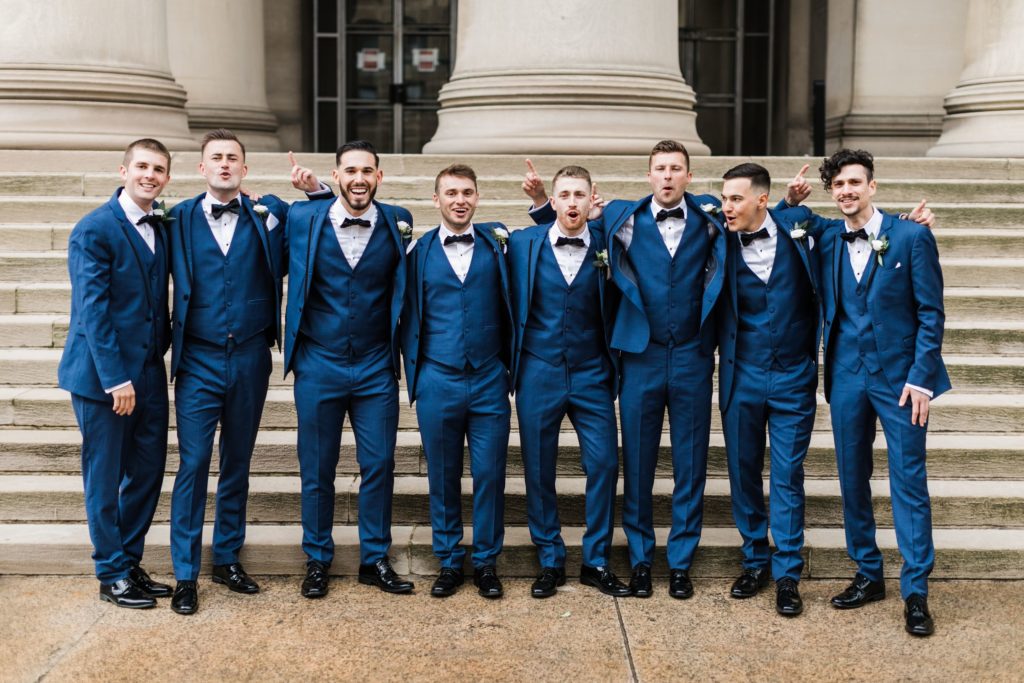 Groom and his groomsmen pose together