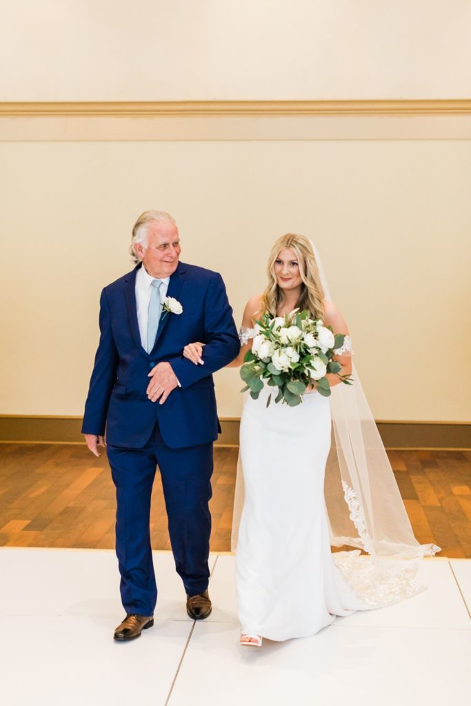 Bride walks down the aisle at her Elegant country club wedding ceremony at Valley Brook Country Club