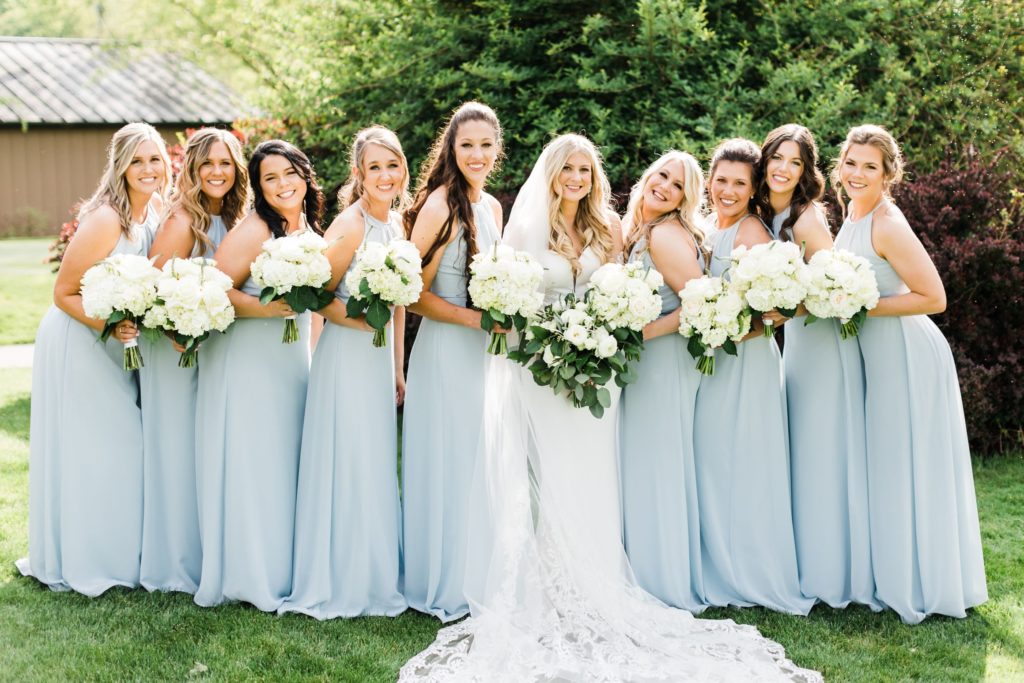 Bride poses with her bridesmaids at her  Elegant country club wedding  at Valley Brook Country Club