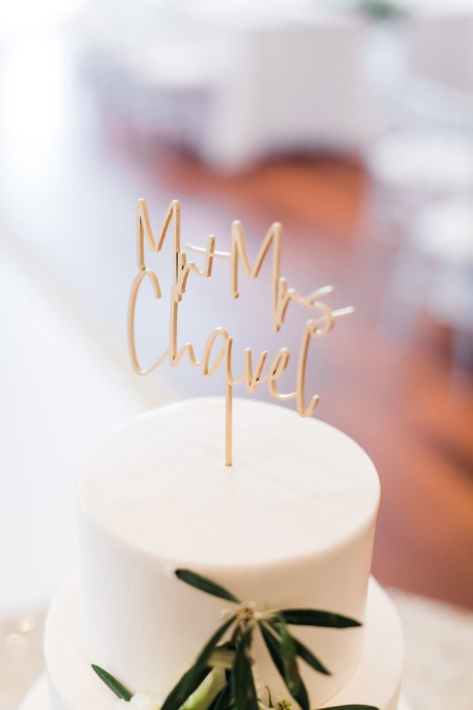 Simple white wedding cake with custom topper at elegant country club wedding at Valley Brook Country Club