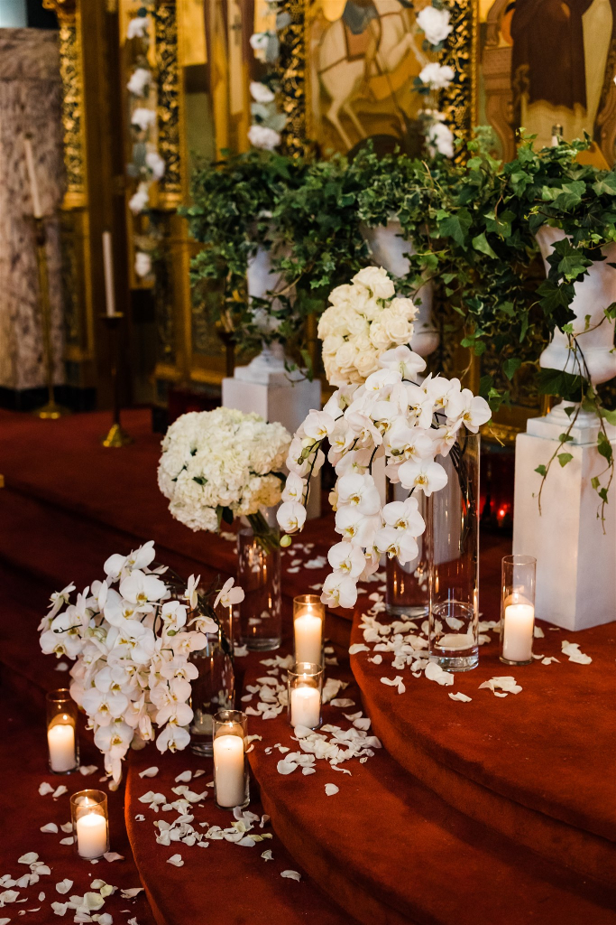 luxe white orchid flower arrangements in church