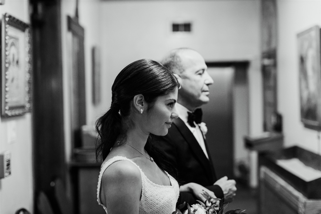 Bride waits to walk the aisle with her father