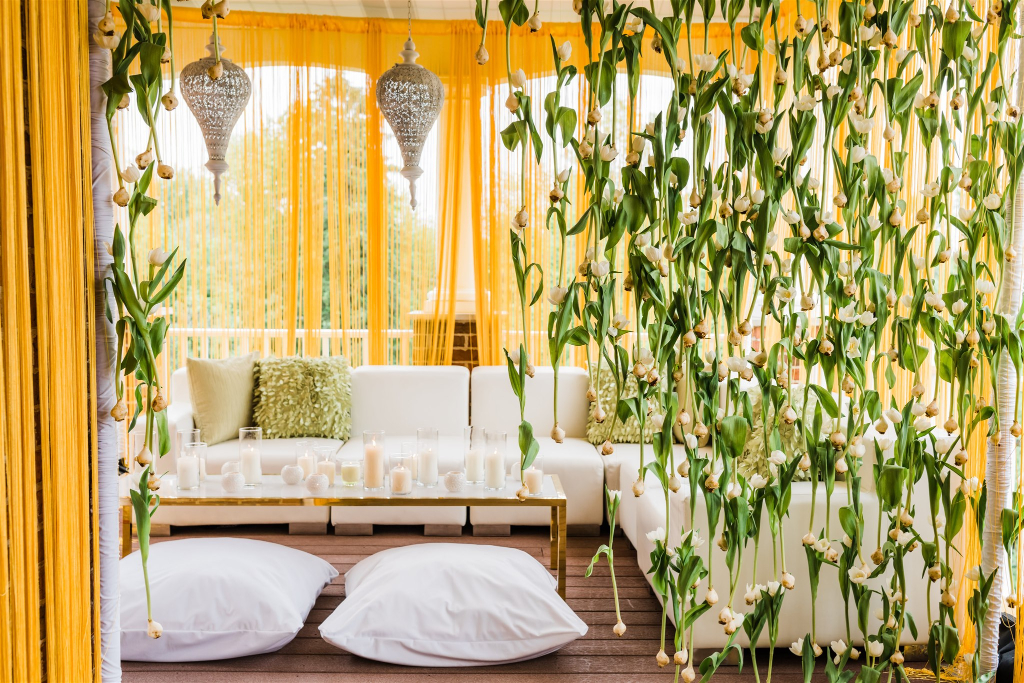 Middle eastern inspired lounge area decorated with lush hanging florals at Luxe Intimate Home Wedding reception