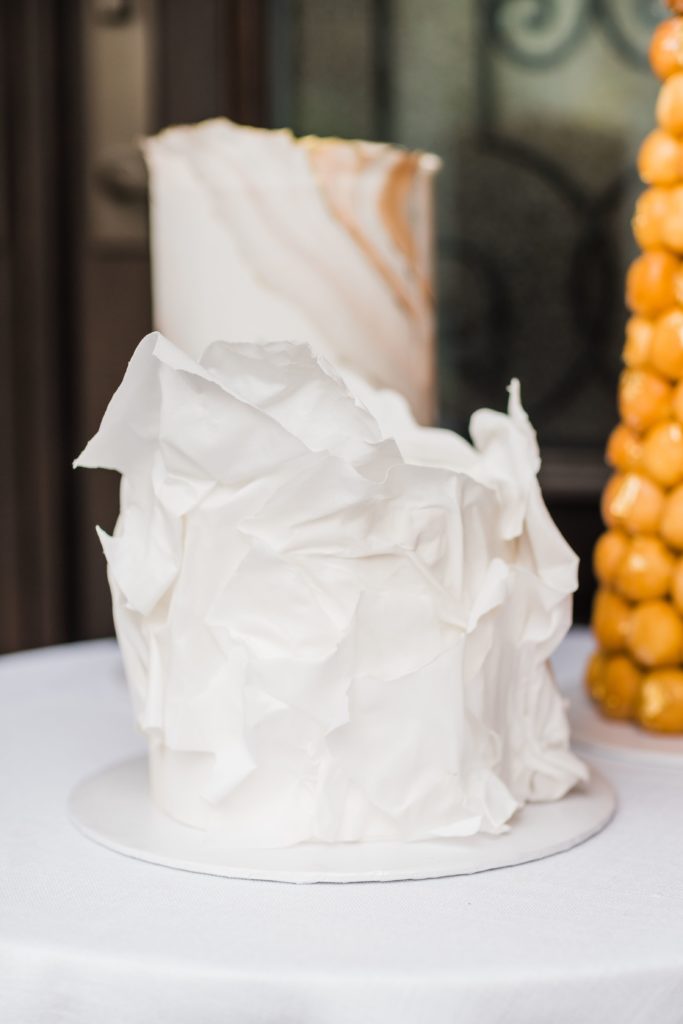 Ruffled, white wedding cake