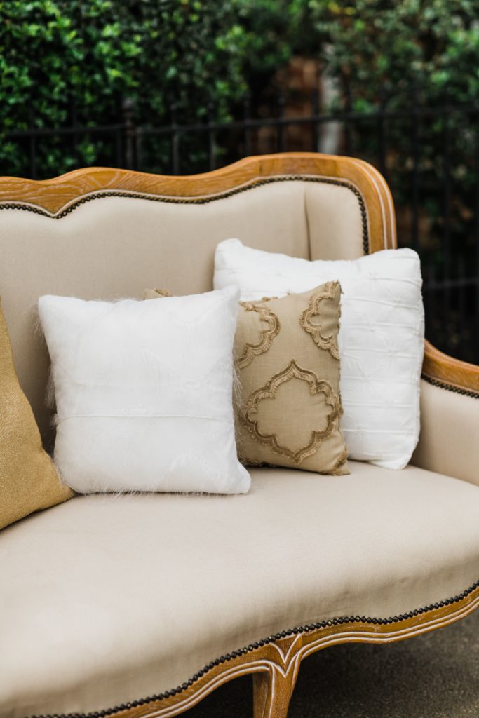 Gorgeous white and tan pillows on couch seating area