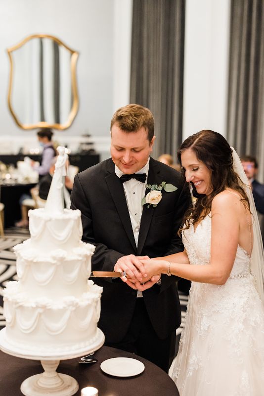 Bride and groom cut cake at Hotel Monaco wedding