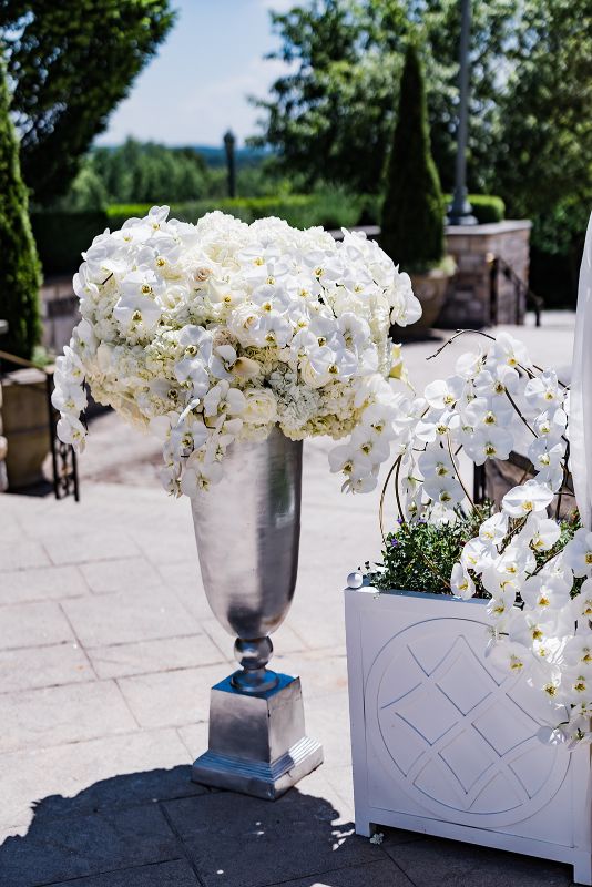 Hydrangea and orchid ceremony floral arrangements