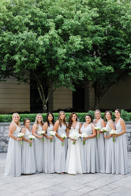Bride with her bridesmaids outside Nemacolin Resort