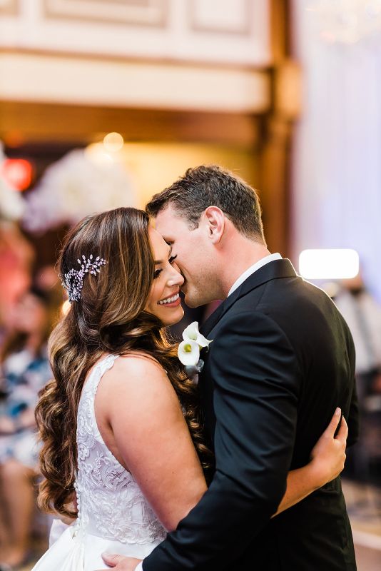 Bride and groom share first dance at at monochromatic Nemacolin Resort wedding reception