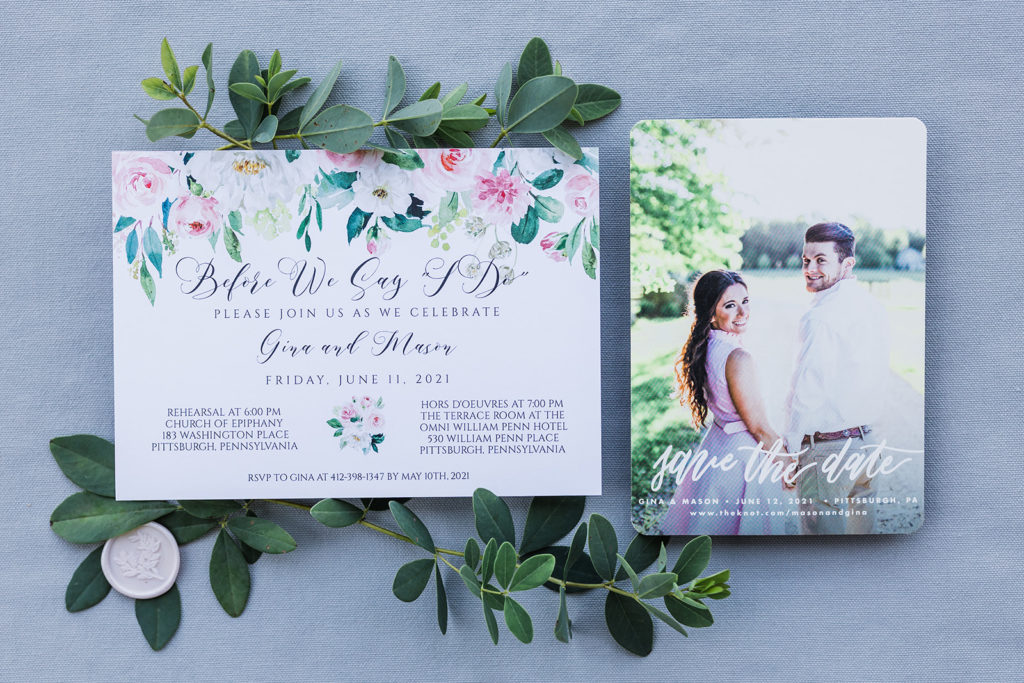 Ivory, green and floral rehearsal dinner invitation flat lay