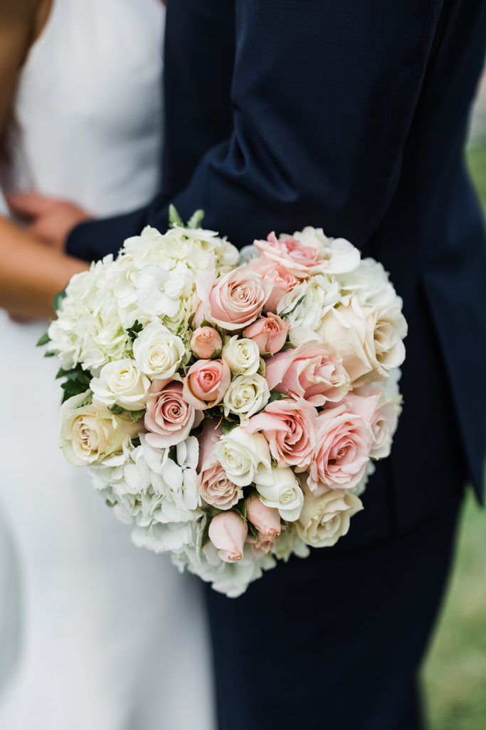 White, ivory and light pink heart shaped wedding bouquet
