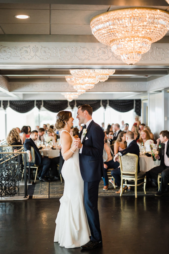 Bride and groom share their first dance at their Pittsburgh city view wedding reception at the LeMont