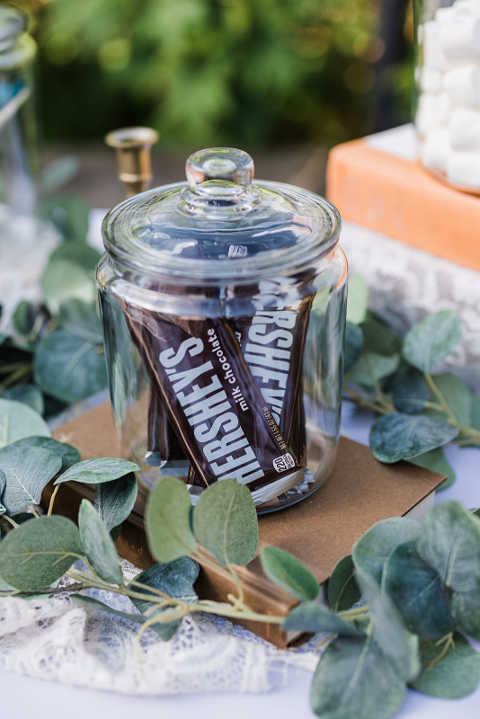 Hershey's bars in clear glass jar for s'more station