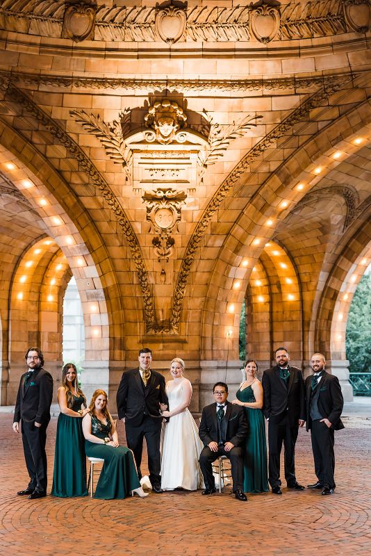 Bridal party poses in front of the Pennsylvanian at their downtown Pittsburgh vow renewal