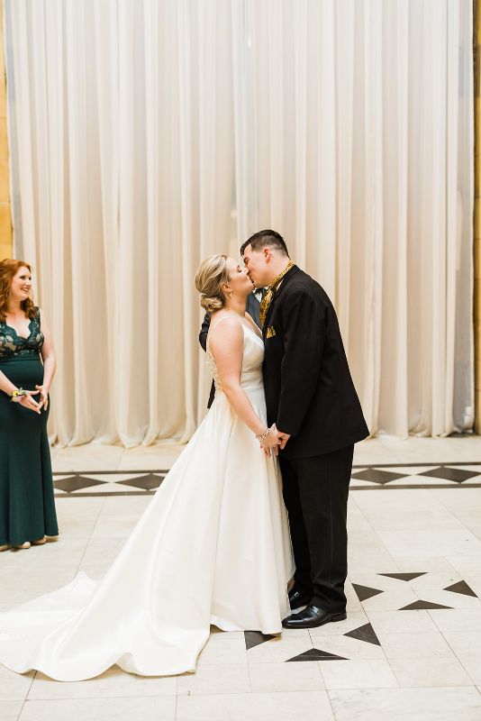 Bride and groom kiss at the end of their downtown Pittsburgh vow renewal
