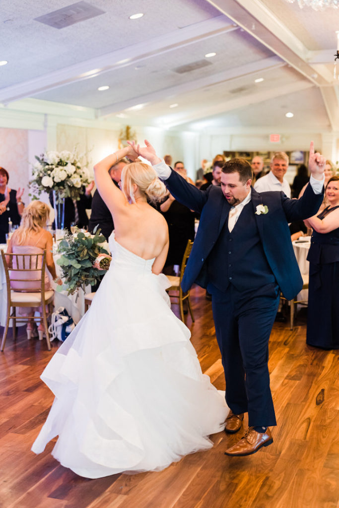Bride and groom share first dance together at Oakmont Country Club Wedding