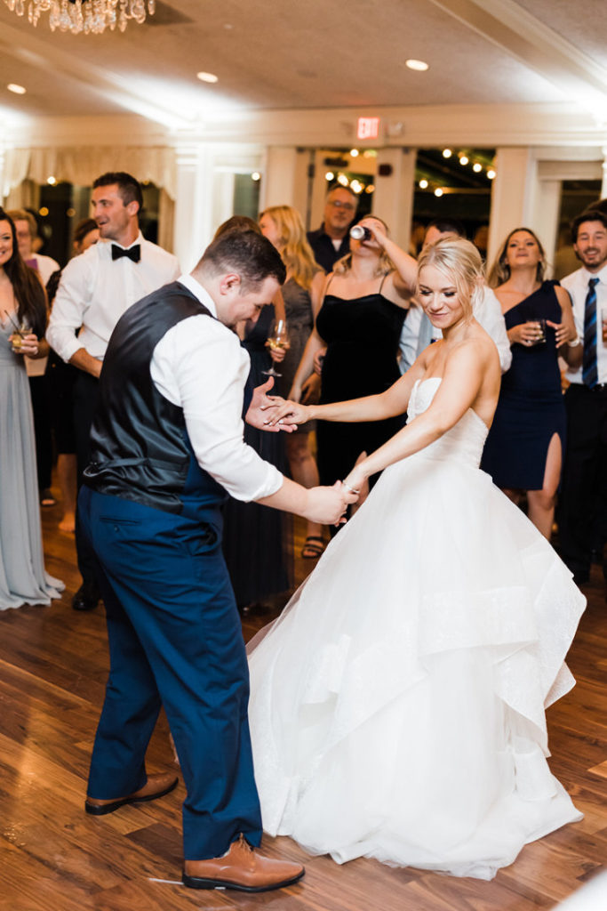Bride and groom dance together at Oakmont Country Club Wedding