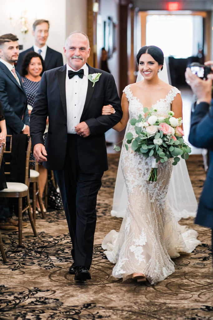 Bride and father walk down the aisle at Southpointe Golf Club Vow Renewal