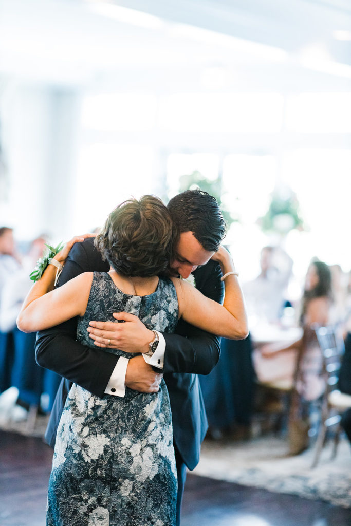 Groom and her son share a dance at Southpointe Golf Club