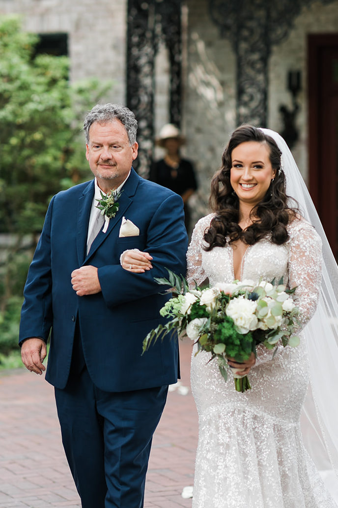 Bride and father walk down the aisle at Succop Nature Park wedding