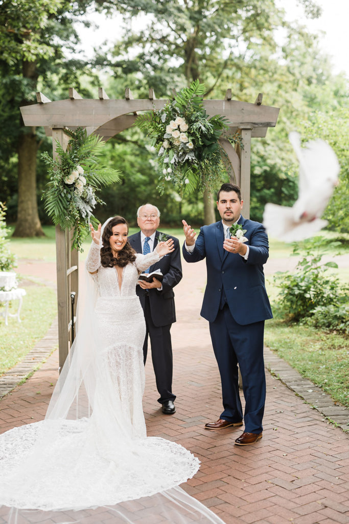 Bride and groom release doves during ceremony at Succop Nature Park