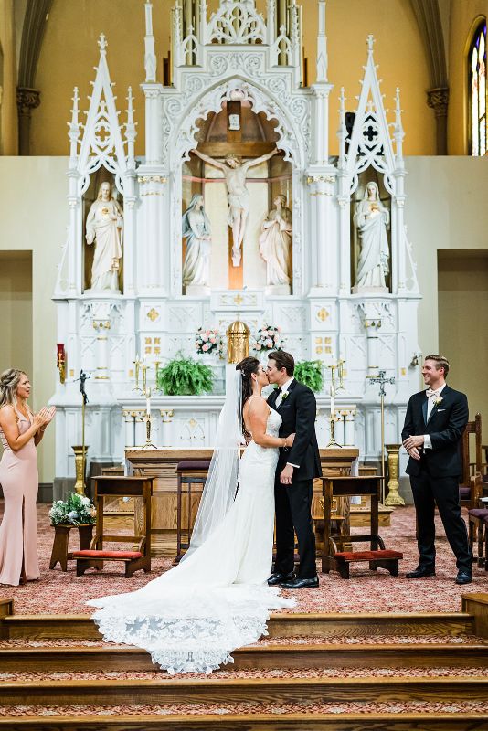 Bride and groom share their first kiss as husband and wife