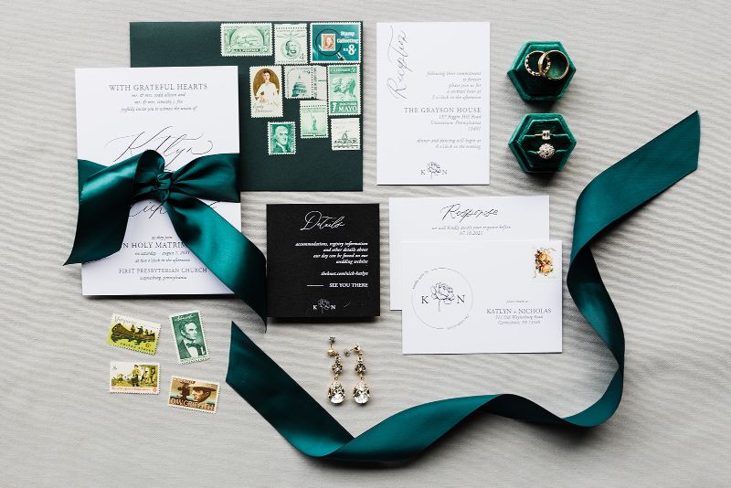 Flat lay of black, white and hunter green flat lay detail photo