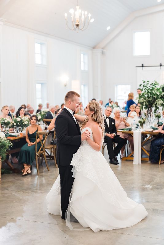 Bride and groom share first dance at summertime Grayson House wedding