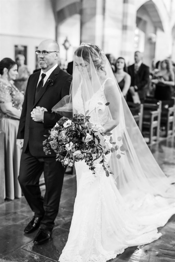 Bride walks down the aisle with her father at Sacred Heart Parish in Shadyside, Pittsburgh, PA