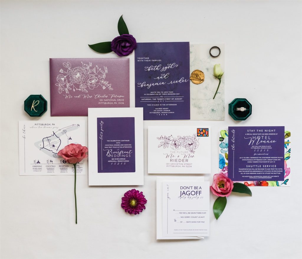 Purple, teal and hunter green stationery flat lay