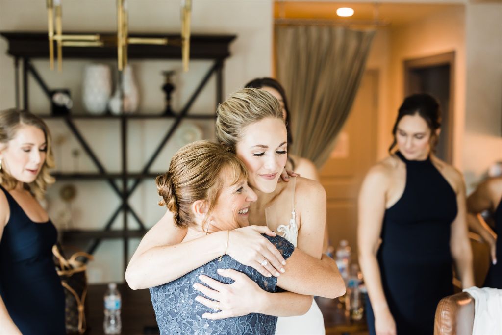 Bride hugs the mother of the groom
