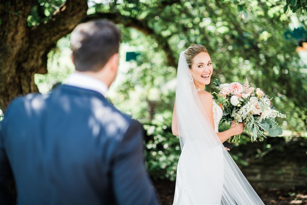 Bride turns to see groom for first look at  Summertime Lounge Vue Wedding