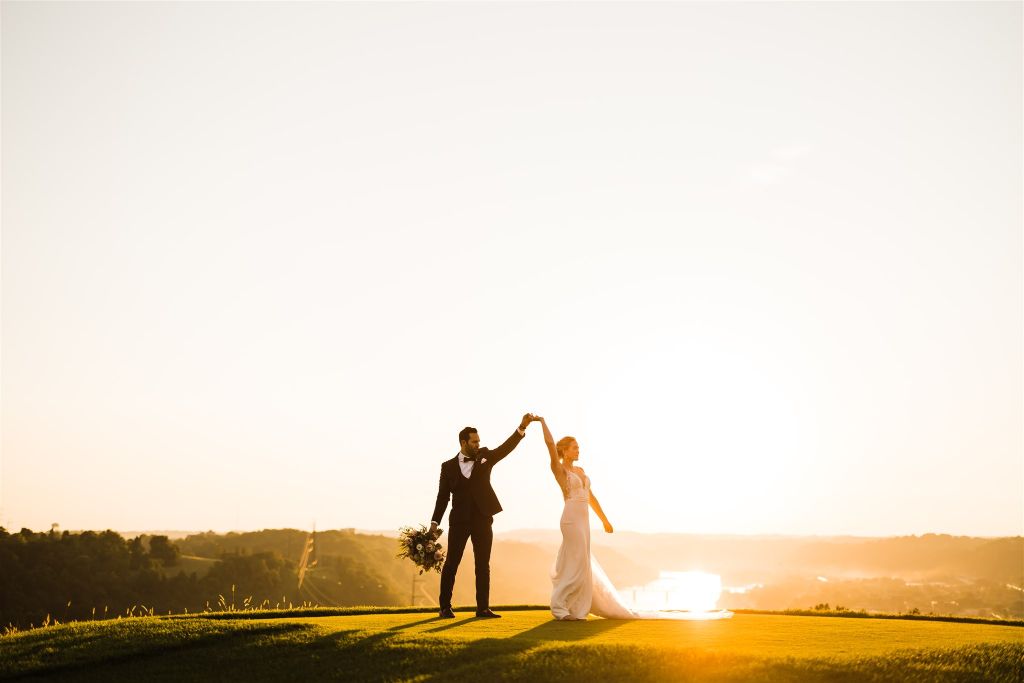 Bride and groom pose together during sunset at Summertime Lounge Vue Wedding