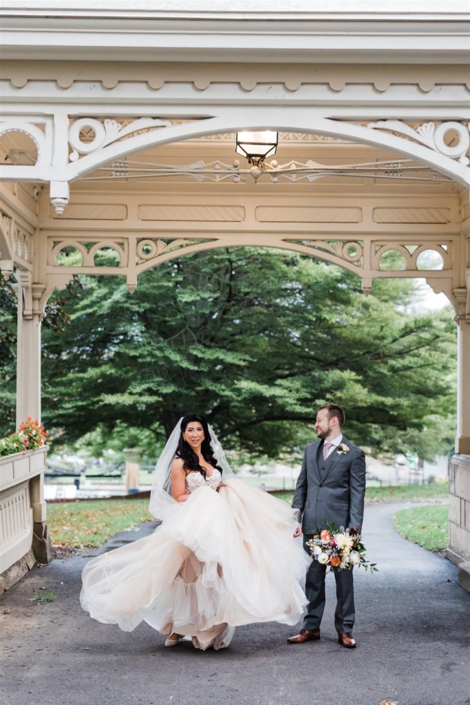 Bride and groom pose at the Frick Clayton House