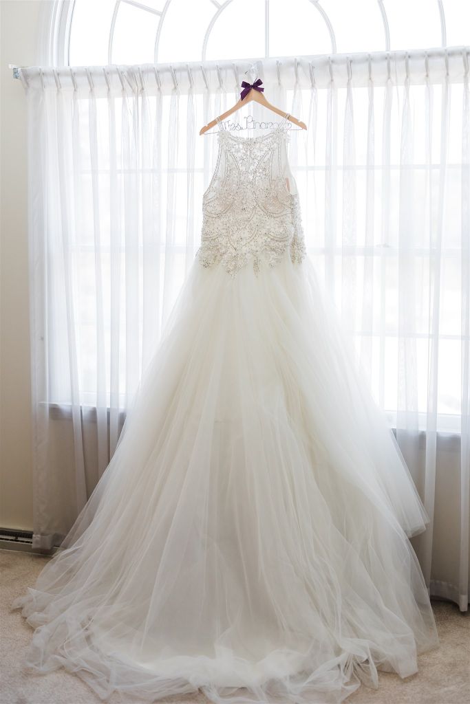 Ivory wedding gown on custom Bride's name hanger