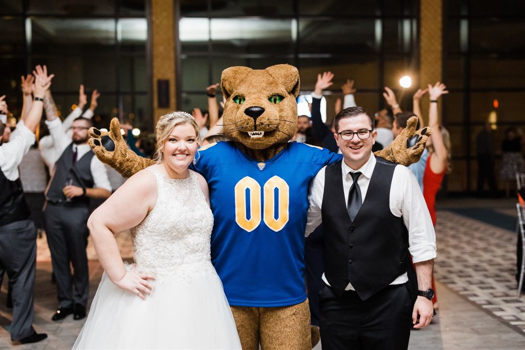 Bride and groom pose with the Pitt Panther mascot