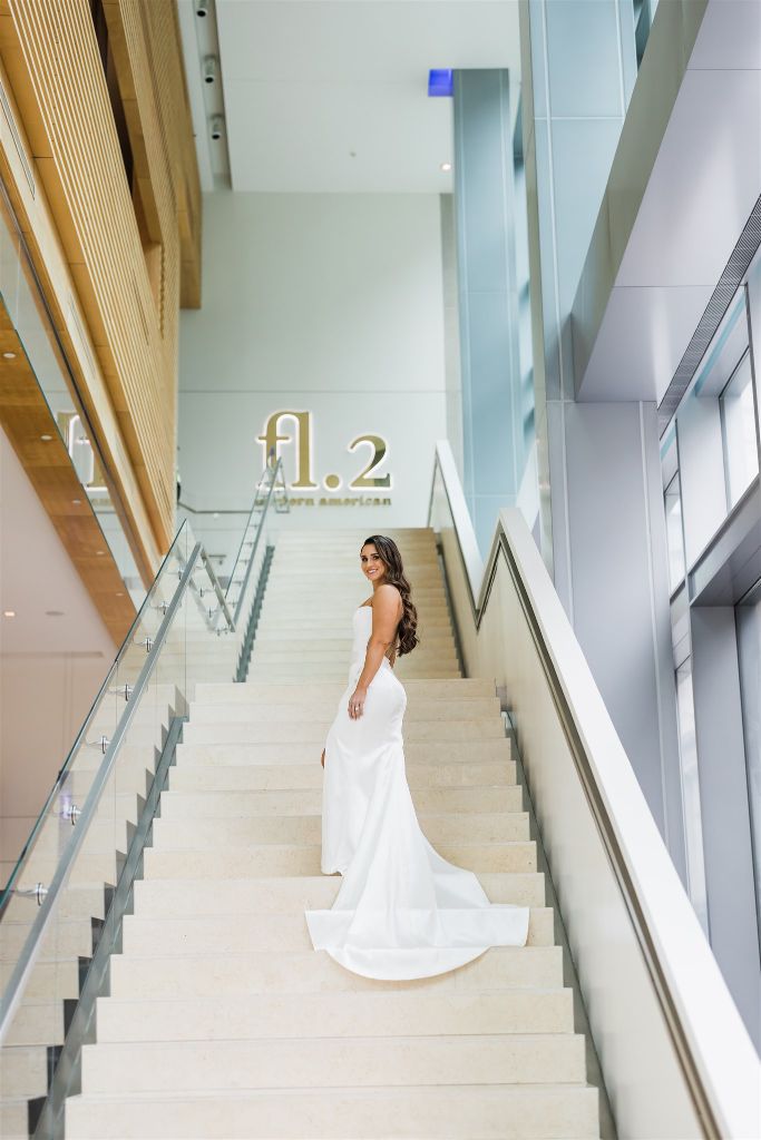 Bride poses on steps of the Fairmont Pittsburgh 
